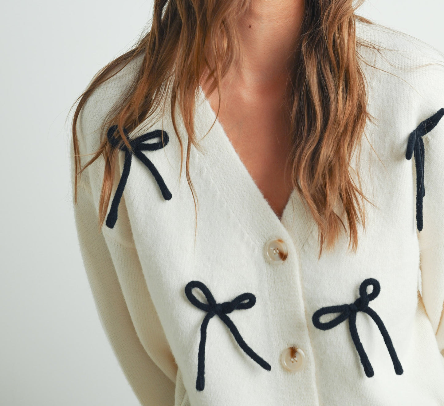 BUTTON DOWN BOW CARDIGAN